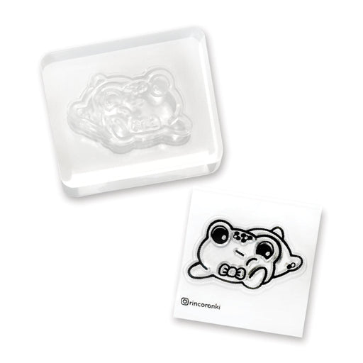 frog bored pensive laying stamp